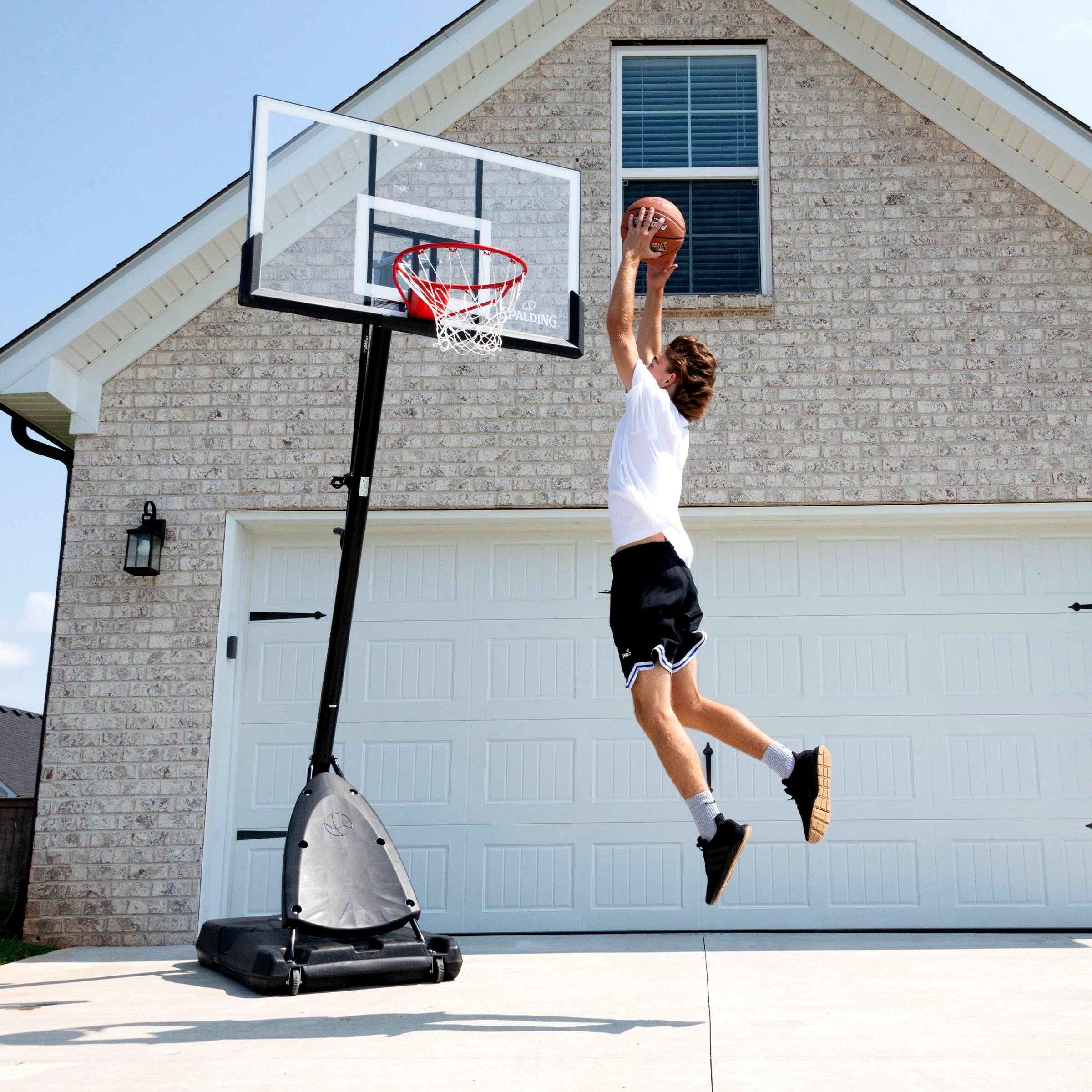 Spalding 54-Inch Portable Basketball Hoop with Shatter-Proof Polycarbonate Backboard, Adjustable ExactaHeight System & Pro Slam Rim-Outdoor Play